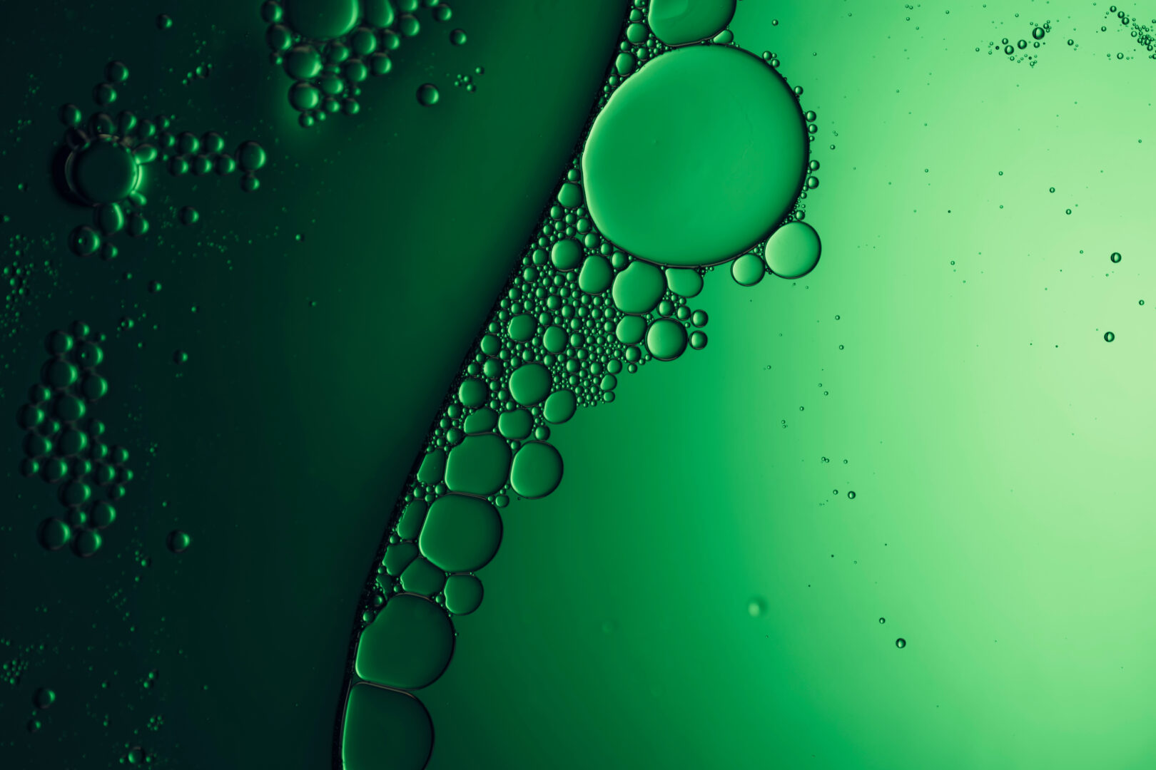 background with bubbles in green liquid